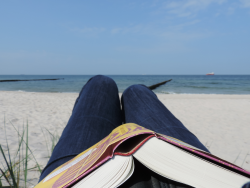 book-on-your-knees-reading-on-the-beach